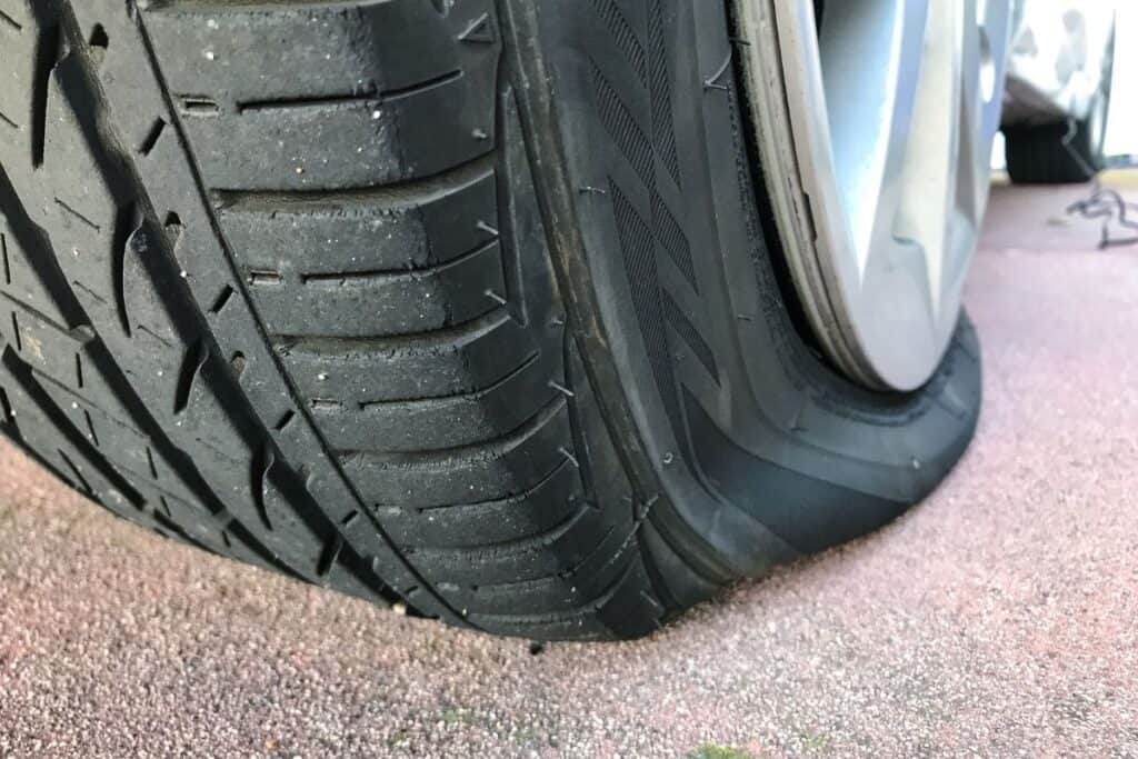 closeup of very flat car tire