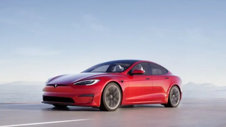 Red Tesla driving