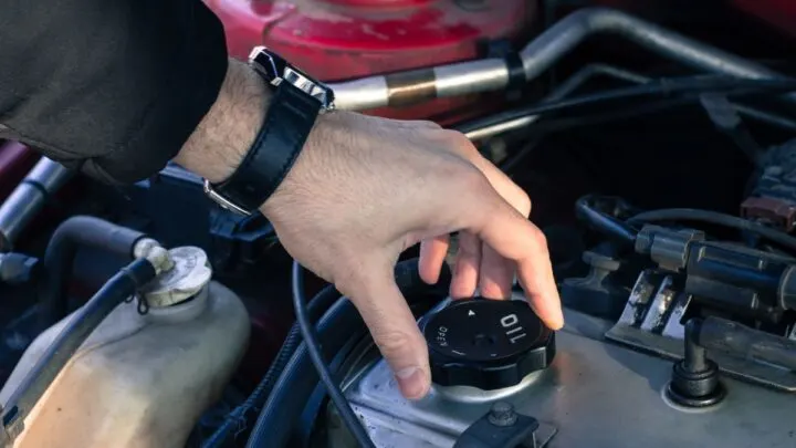 Man opening a gas cap