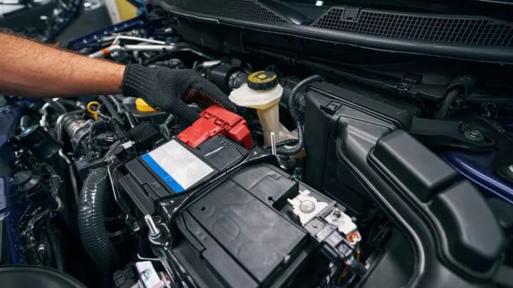 Person checking the car battery