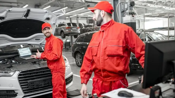 Mechanics checking engine